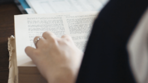 A female student at Dayspring Christian Academy in Lancaster, PA studies a book written in Greek.